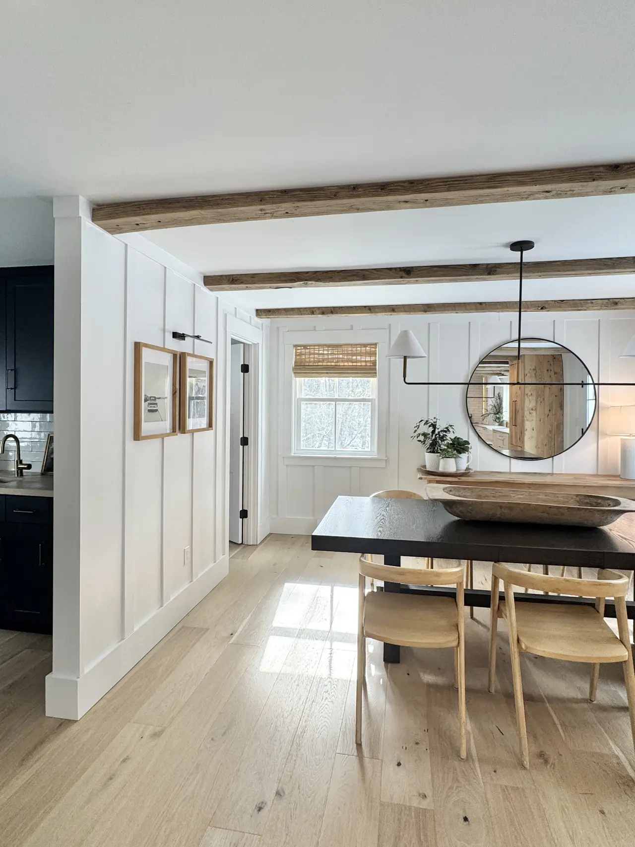 Open kitchen and dining with white shiplap and wide-plank floors